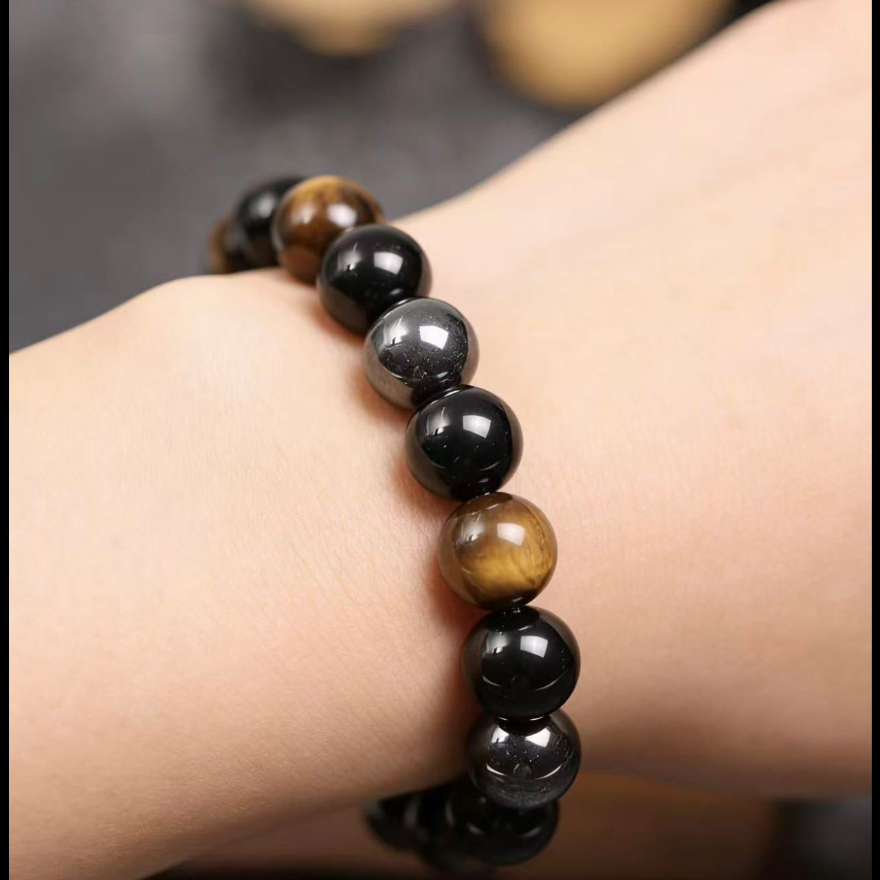 Obsidian tiger eye magnetite triple protection bracelet spiritual jewelry — side angle product | BuddhaManifest™