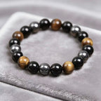 Obsidian tiger eye magnetite triple protection bracelet spiritual jewelry — stack styling shot | BuddhaManifest™