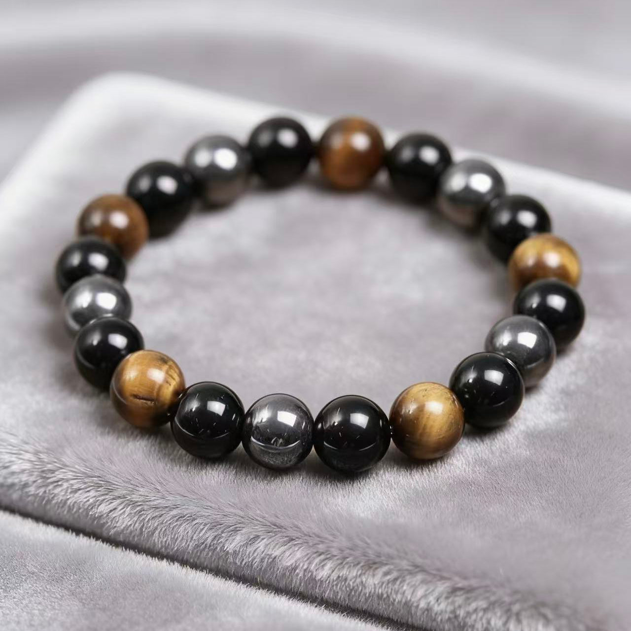 Obsidian tiger eye magnetite triple protection bracelet spiritual jewelry — stack styling shot | BuddhaManifest™