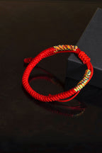 Tibetan Vajra knot red string hand-knotted protection sacred cord bracelet — full bracelet coil | BuddhaManifest™