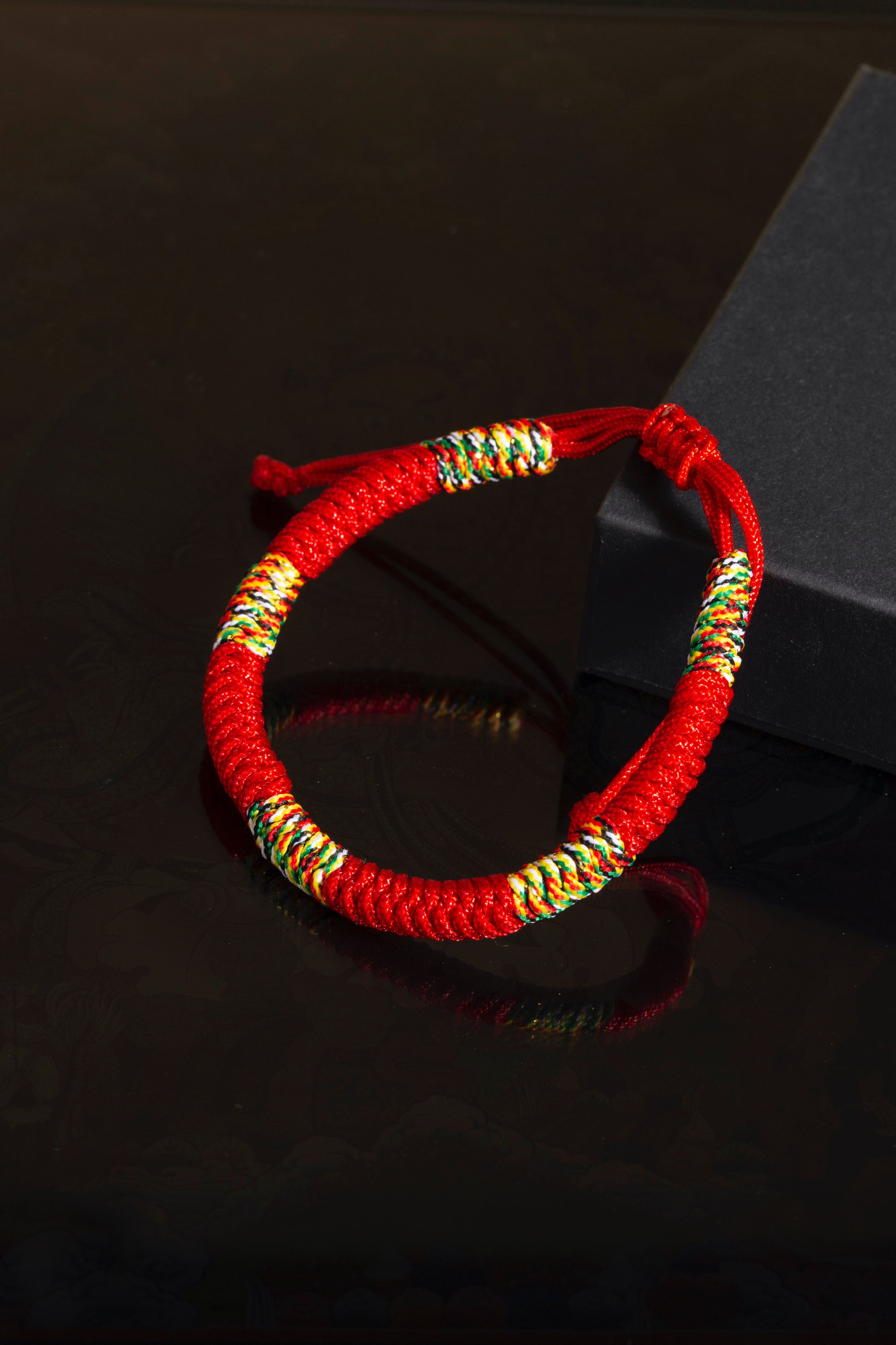 Tibetan Vajra knot red string hand-knotted protection sacred cord bracelet — flatlay front view | BuddhaManifest™