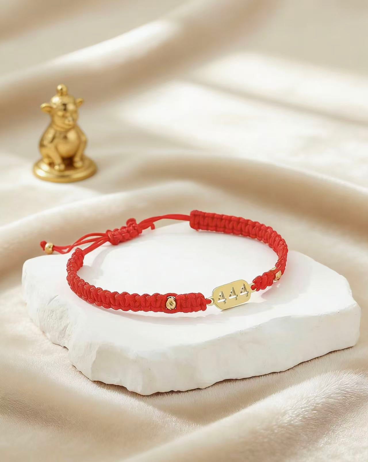 444 angel number red string bracelet divine protection grounding cord — macro stone texture | BuddhaManifest™