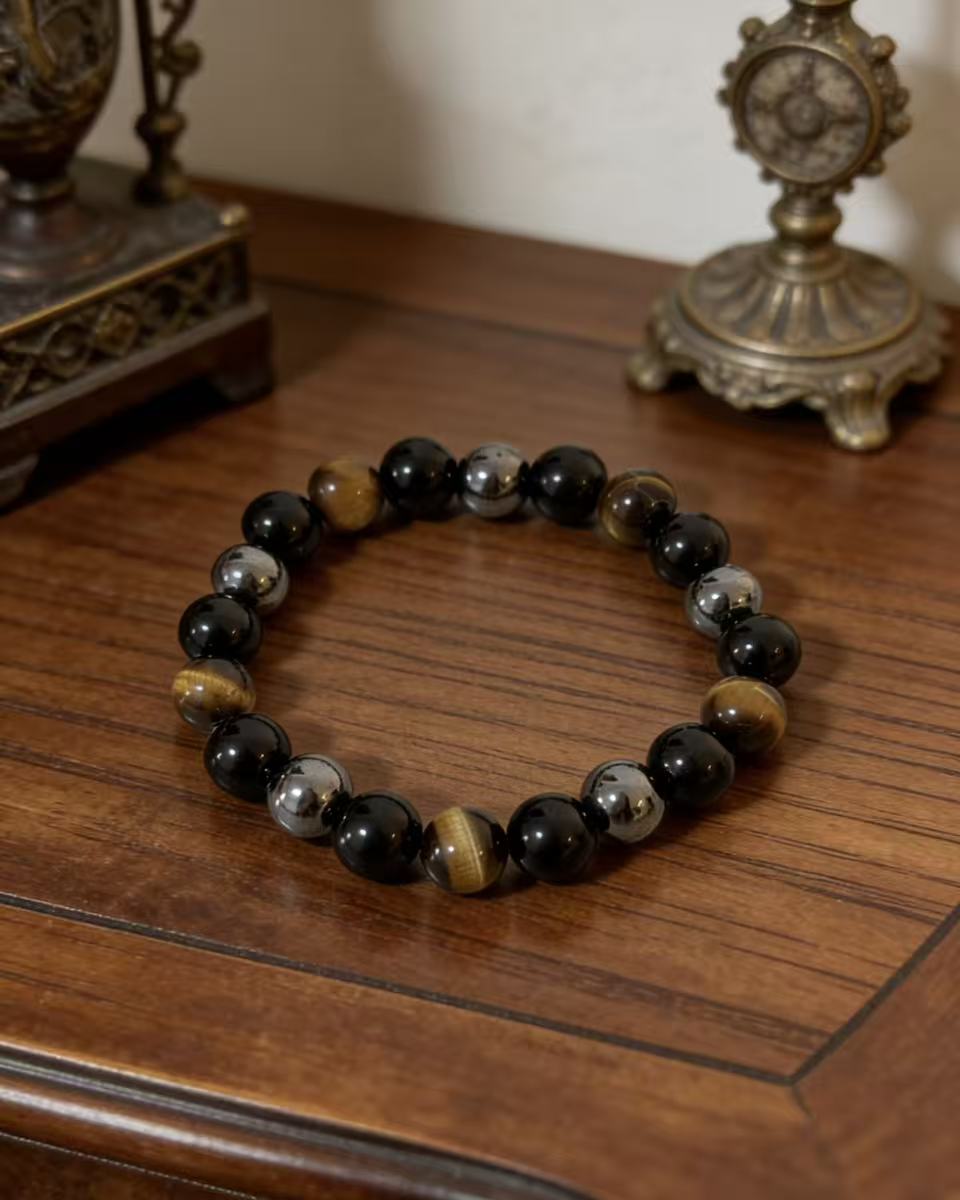 Triple protection tiger eye obsidian hematite bracelet courage shield — macro stone texture | BuddhaManifest™
