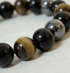 Triple protection tiger eye obsidian hematite bracelet courage shield — stack styling shot | BuddhaManifest™