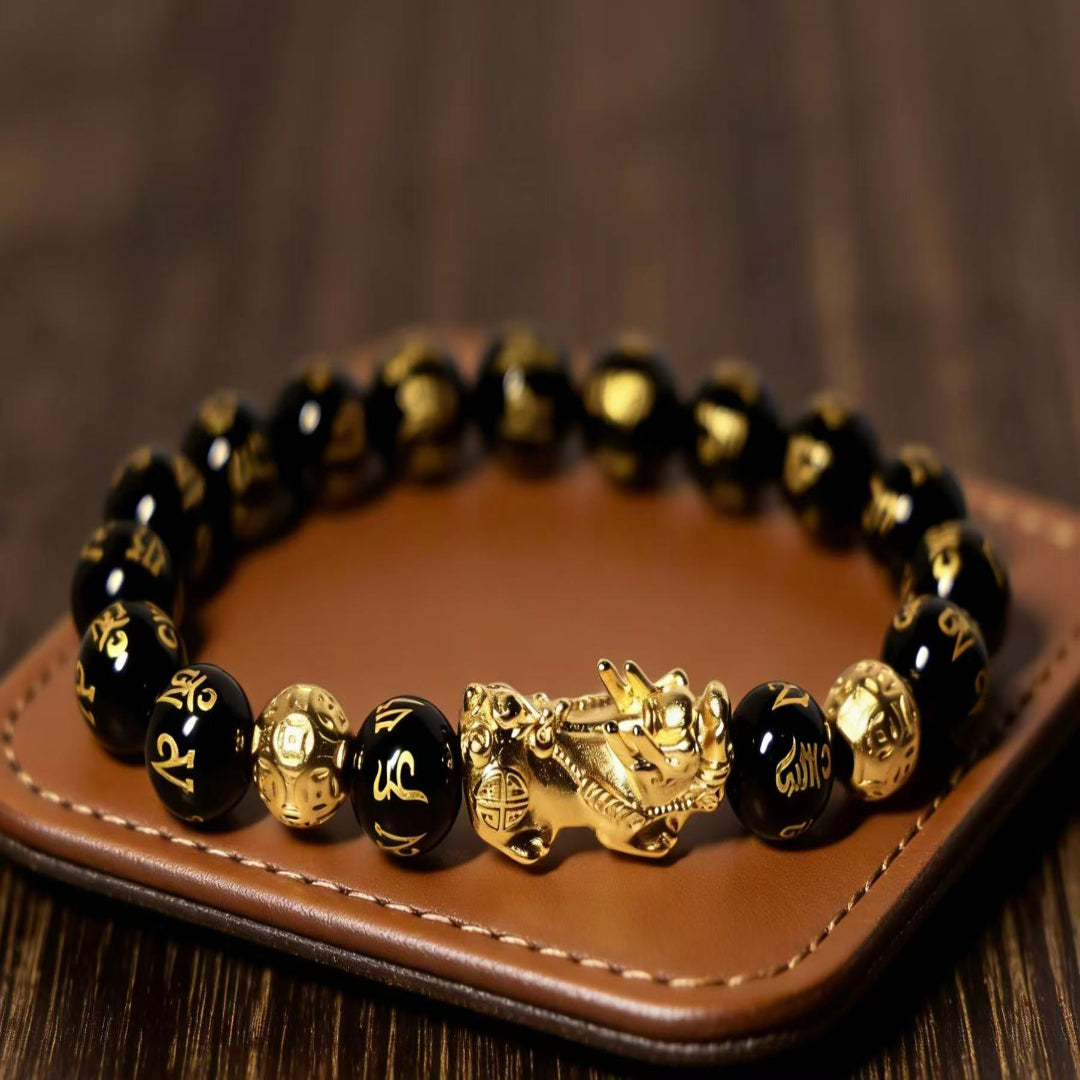 Black obsidian Pixiu Six True Words mantra wealth protection bracelet — close-up hardware | BuddhaManifest™