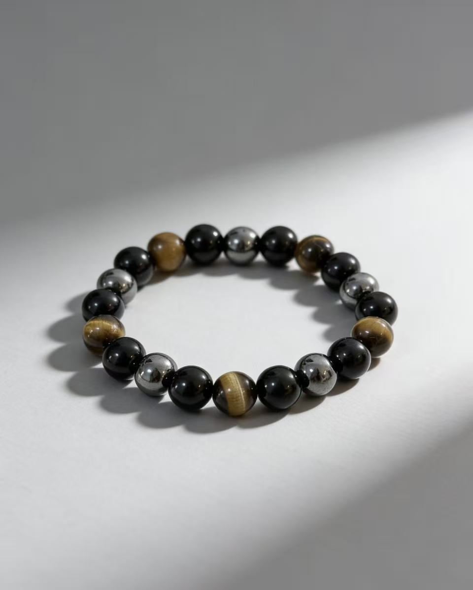 Triple protection tiger eye obsidian hematite bracelet courage shield — flatlay front view | BuddhaManifest™